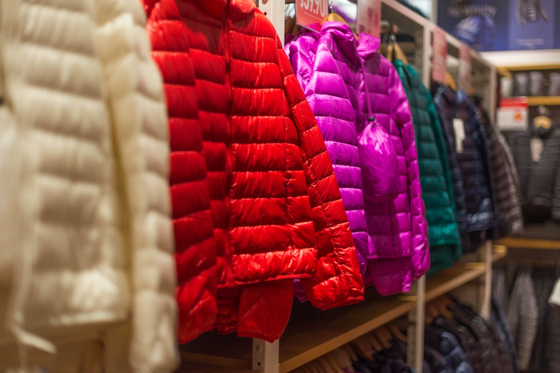 Uniqlo assorted color bubble jackets hanged